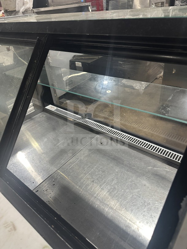 Senkar refrigerated bakery display case, model NETA4FT, clear glass, black base, multi-tiered, no compressor.