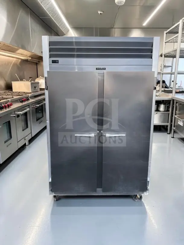 Traulsen G20010 two-section commercial reach-in refrigerator in excellent condition, 46 Cu. Ft., two solid doors, 115V.