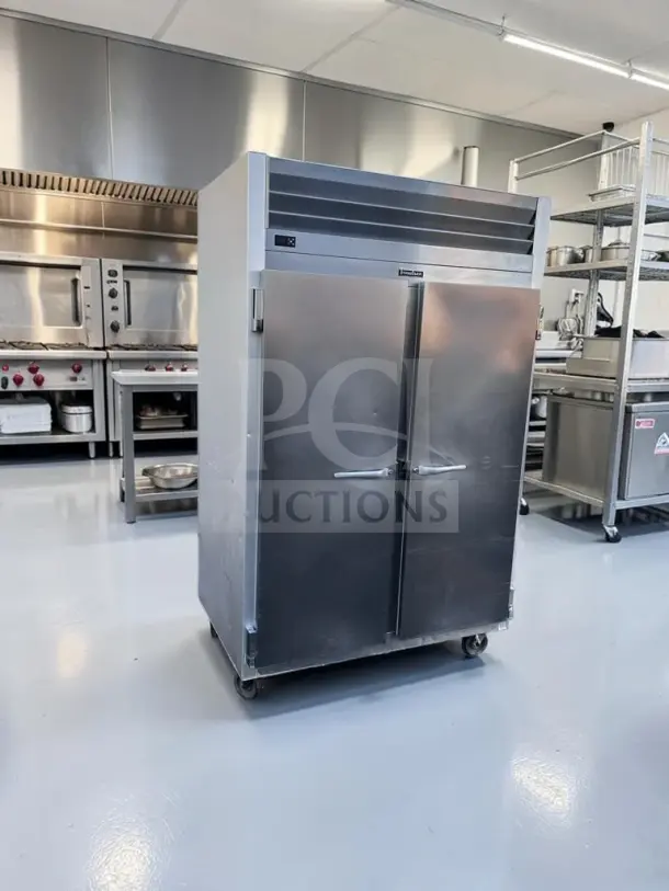 Traulsen G20010 two-section reach-in refrigerator, 46 cu. ft., two solid doors, excellent condition, fully tested.