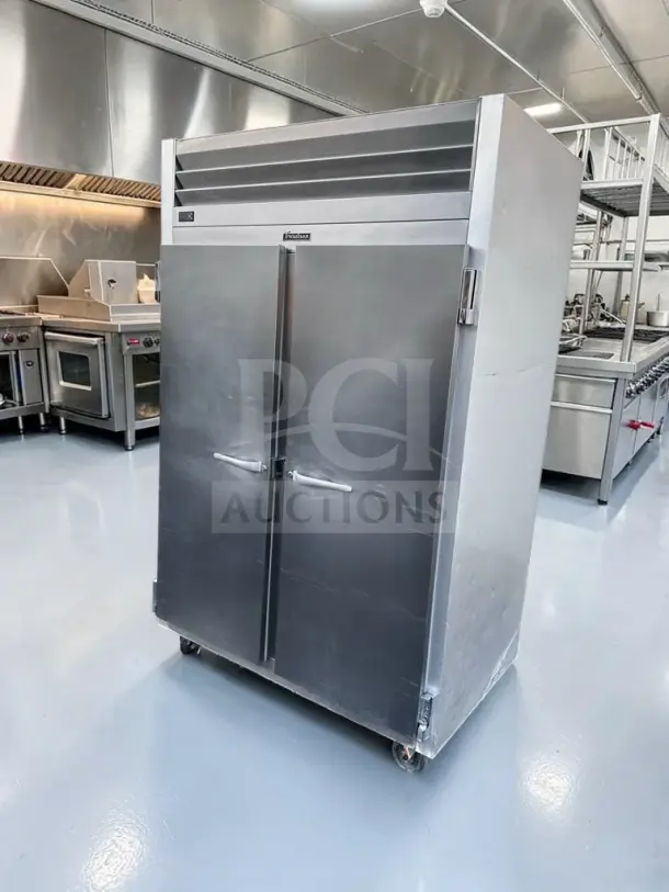 Traulsen G20010 commercial refrigerator, 52.13", two-section, 46 Cu. Ft., stainless steel, excellent condition, two solid doors.