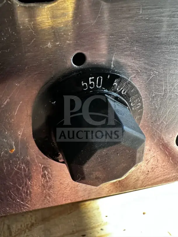 Close-up of thermostat control knob on Jade JGT-2448 gas griddle. Numbers indicate temperature settings from 450 to 550 degrees Fahrenheit.
