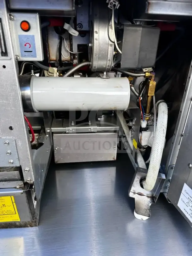 Prime Condition Frymaster 2FQG30U dual gas fryer interior, showing operational components and built-in filtration system.