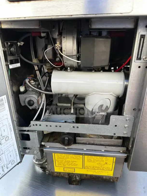 Frymaster 2FQG30U dual gas fryer interior, showing SMART4U controllers and built-in filtration system, 30-lb frypots.