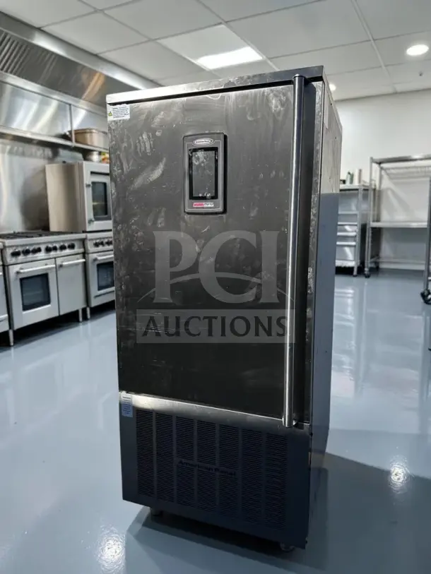 American Panel AP12BCF110-3 blast chiller in exceptional condition, stainless steel, 24 pan capacity, UL & NSF certified.