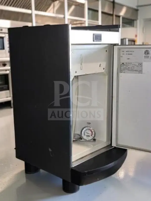 Egro KS9 commercial milk refrigerator, 6.5-liter capacity, with integrated milk pump and level sensor, open door view, fully tested.