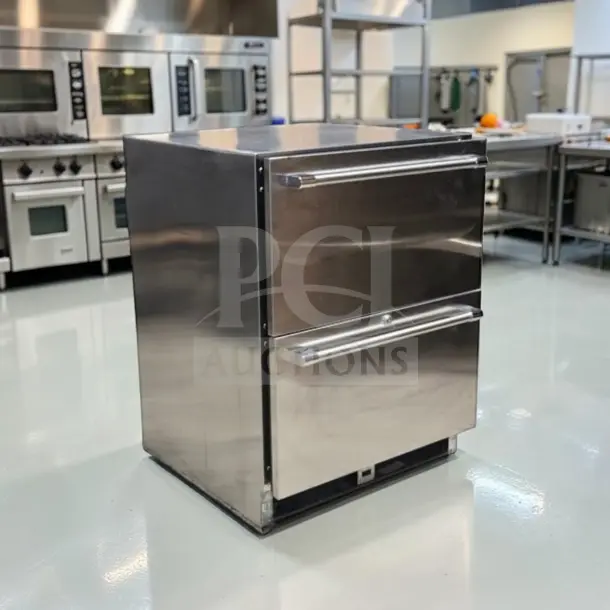 Stainless steel two-drawer undercounter refrigerator, commercial grade, optimal condition, space-saving design, fully tested.