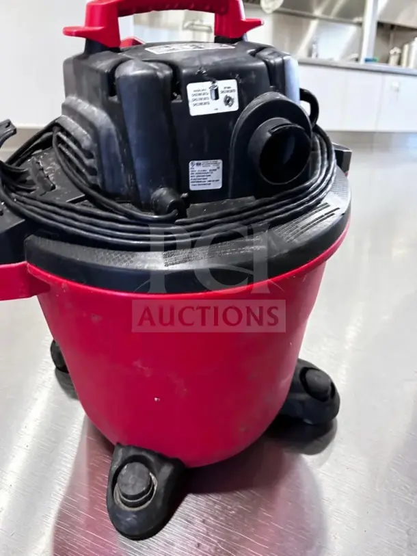 Craftsman CMXEVBE17595 16-gallon wet/dry vac, 6.5 HP, red and black, heavy-duty. Visible labels indicate model and specs.