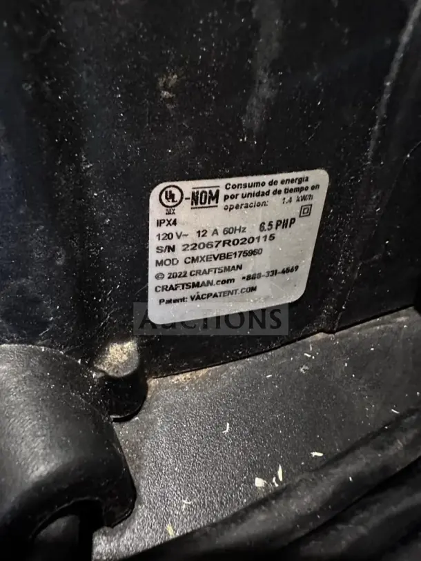 Label on Craftsman CMXEVBE17595 shop vacuum, displaying model, serial number, IP rating, and power specifications.