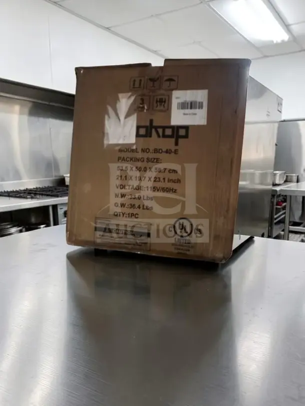 ZOKOP BD-40-E upright freezer in new/open box. 31.1L capacity, 1.1 cu. ft., 115V, cULus listed. Box shows model and dimensions.