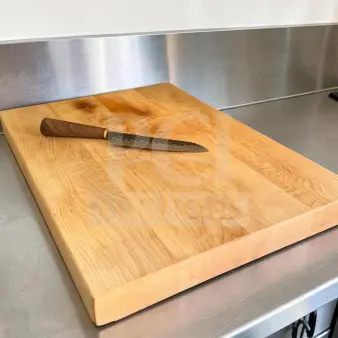Large maple butcher block cutting board, 24"x18", in good condition with non-slip feet. Ideal for restaurant use.