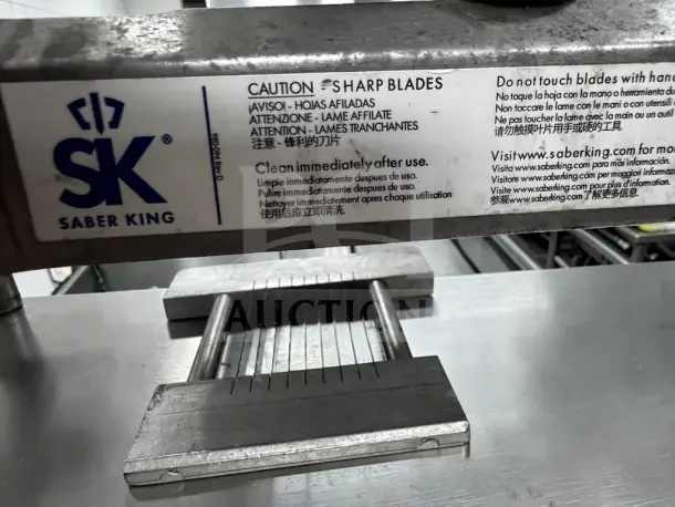Prince Castle 980-000-00 Saber King manual slicer, optimal condition, NSF certified, with caution label for sharp blades.