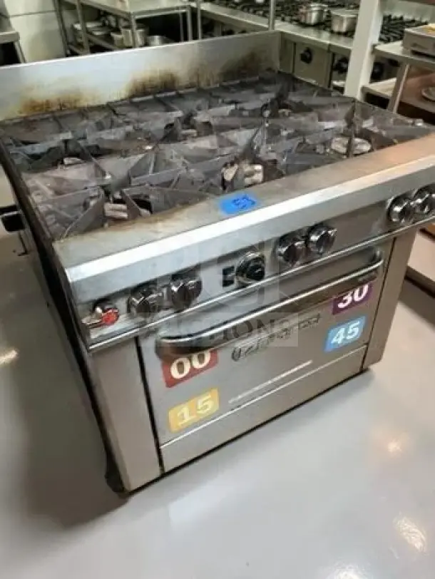 Southbend S36D 36" 6-burner gas range, excellent condition, 203,000 BTU, with oven, control labels visible, fully tested.