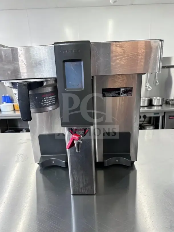 FETCO CBS-2132XTS coffee brewer, stainless steel, dual brew, tested and operational, 240V, clear display, visible controls.