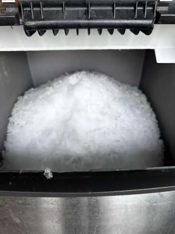 Scotsman NME1254AS-32B ice machine producing nugget ice, outstanding condition, 1,220 lb/24hr, air-cooled, fully operational.