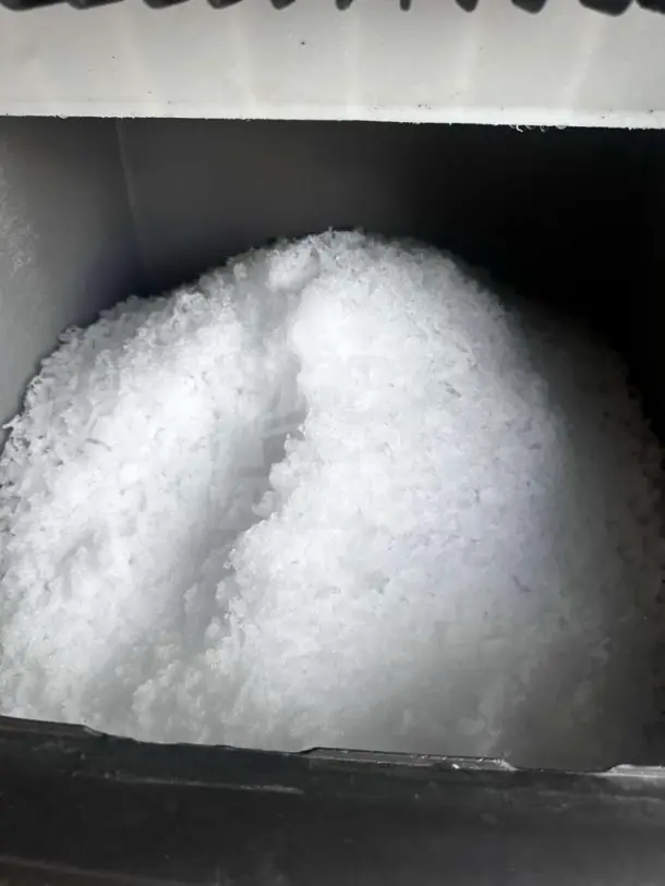 Scotsman NME1254AS-32B ice machine interior, full of nugget ice, showcasing operational condition.