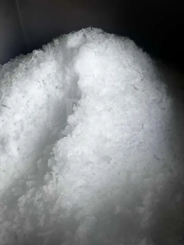 Close-up of ice flakes produced by Scotsman NME1254AS-32B ice machine, showcasing texture and quality.