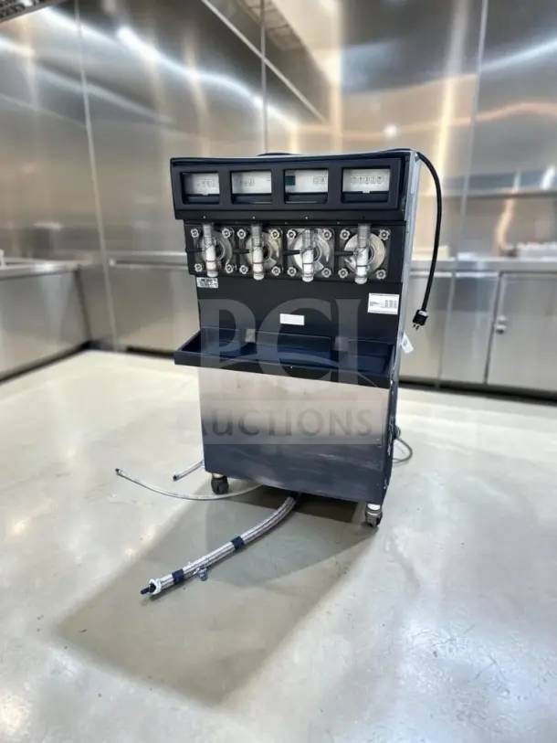 Taylor 349-33 commercial slush machine, 4-flavor, stainless steel, exceptional condition, 208–230V, 3-phase, UL/NSF listed.