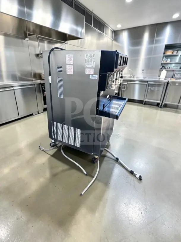 Taylor 349-33, 4-flavor frozen beverage machine in excellent condition, commercial-grade, 208-230V, UL/NSF listed.