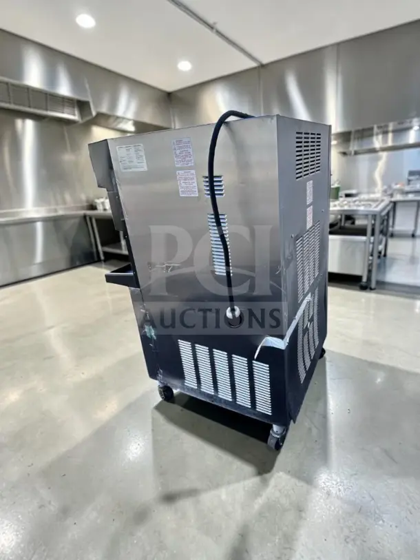 Taylor 349-33 slush machine in excellent condition, 208-230V, 3-phase, UL/NSF listed, side view showing labels.