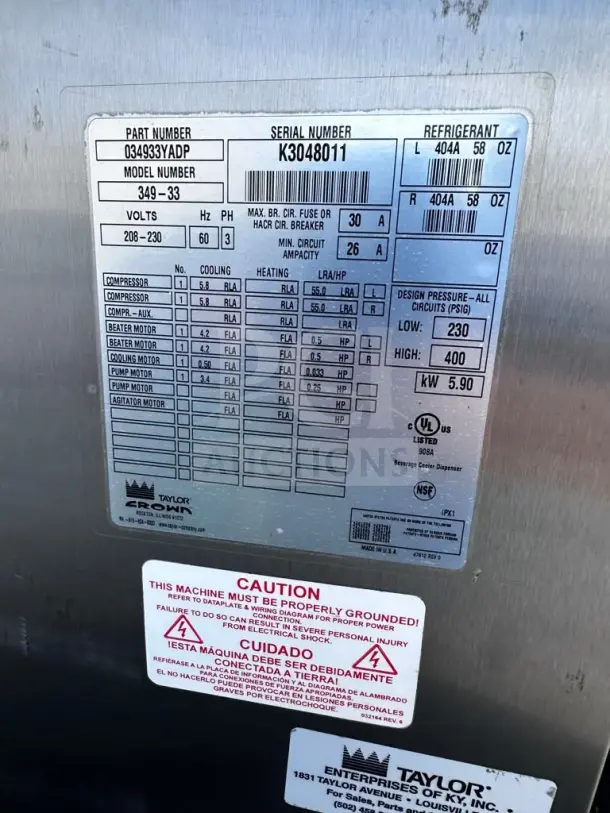 Label on Taylor 349-33 frozen beverage machine. Details: 208-230V, 3-phase, UL/NSF listed. Serial: K3048011. Caution for grounding shown.