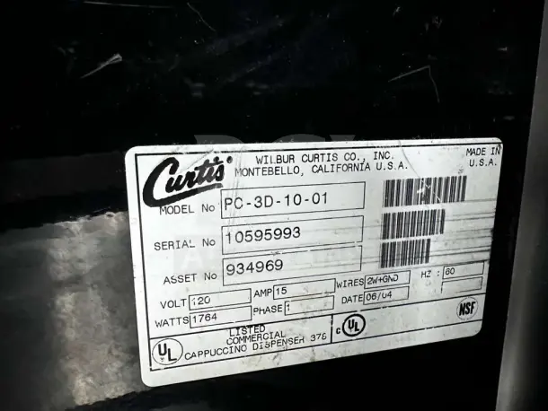 "Wilbur Curtis model PC-3D-10-01 label on cappuccino machine, showing serial number, voltage, and certifications."
