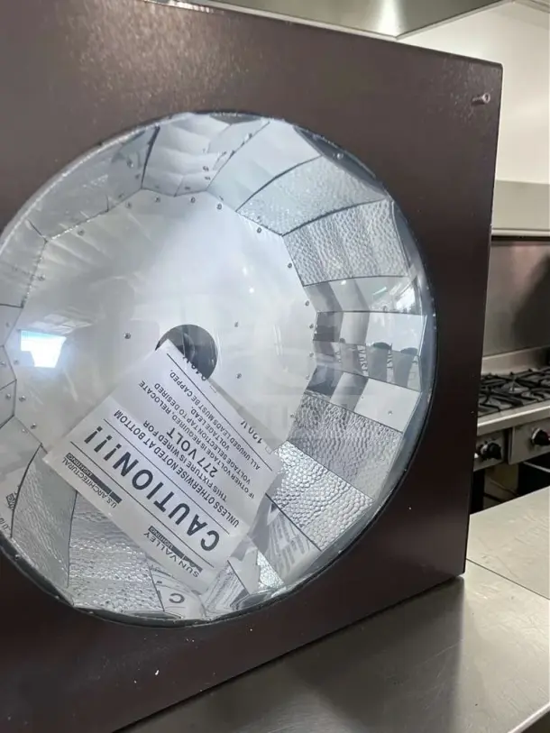 Sun Valley Lighting 24x24 commercial ceiling light fixture in reflector housing, 277V, new condition, caution label visible.