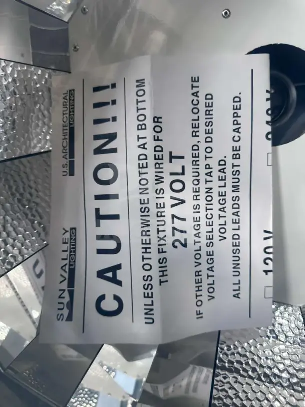 Sun Valley Architectural Lighting ceiling fixture, 24x24, model SUN-S-LGT-0712, 277V, new condition, caution label visible.