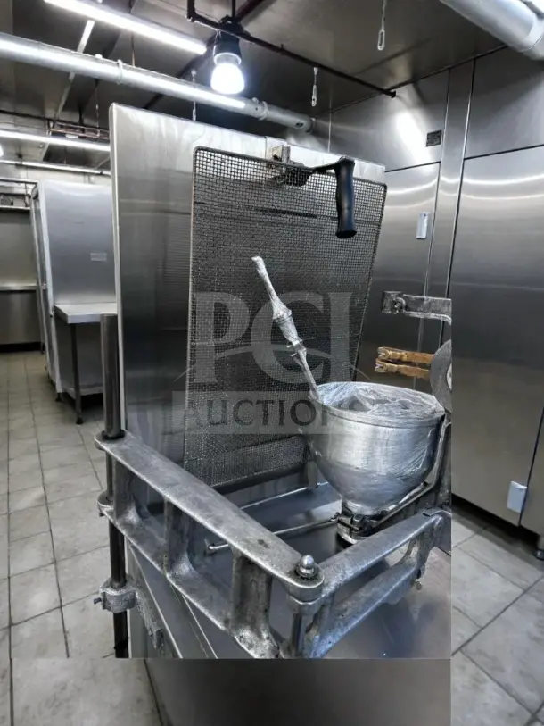 Lucks G1826 commercial donut fryer with stainless steel kettle, donut screen, and manual depositor in excellent condition.