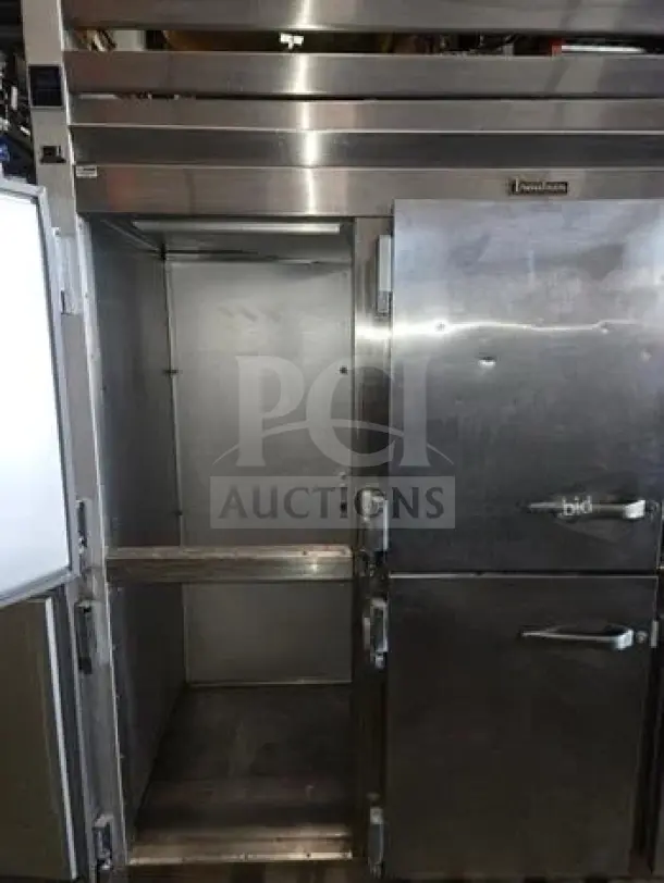 Prime Condition Traulsen G30001 three-section reach-in refrigerator with six half solid doors, NSF & cETLus listed, 115V.