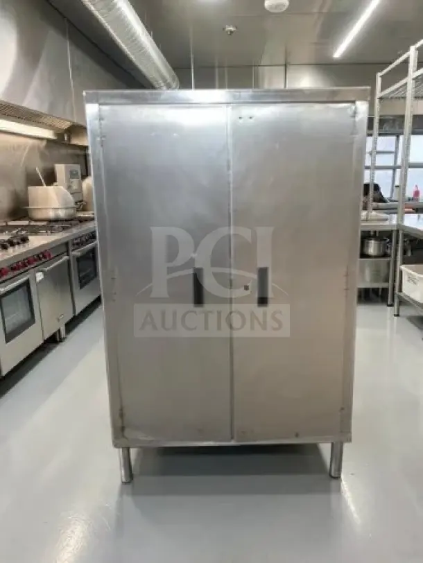 Stainless steel industrial storage cabinet, 34" x 18" x 54", two-door, first-class condition, ideal for restaurant use.