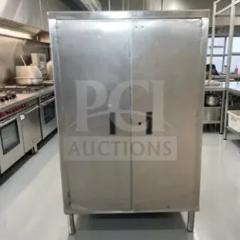 Stainless steel industrial storage cabinet, 34" x 18" x 54", two-door, first-class condition, ideal for restaurant use.