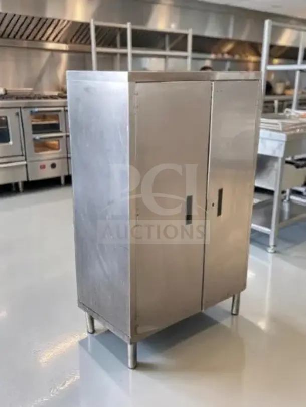 Stainless steel industrial storage cabinet, 34"x18"x54", two-door, first-class condition, for commercial use.