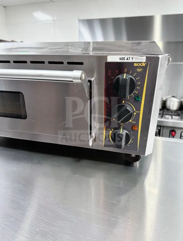 Alt text: Equipex SODIR PZ4302D countertop electric pizza oven, single deck, 120V, 5700W, stainless steel, control dials visible.