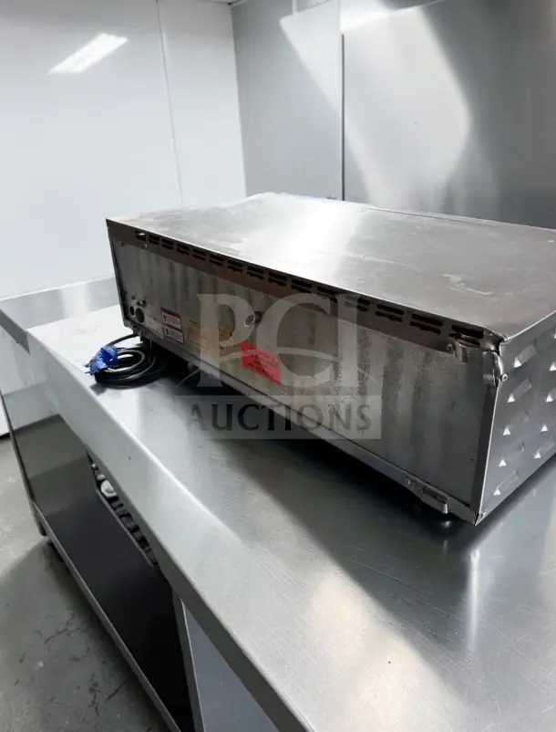 Equipex SODIR PZ4302D electric pizza oven, elite condition, countertop model. Features 5700W power, fire brick stone deck, ETL listed.