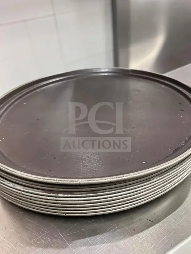 Large oval non-skid serving trays, 27x22 inches, brown, commercial grade. Well-maintained and professionally inspected.