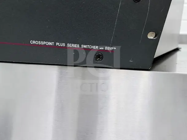 Extron CrossPoint Plus 1616 HVA switcher, black finish, part of the control panel visible, in good condition.