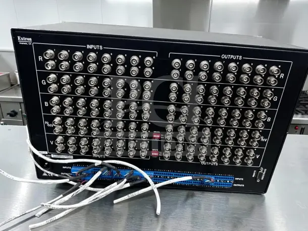 Extron CrossPoint Plus 1616 HVA matrix switcher, 16x16 RGBHV & stereo audio, 425 MHz, fully operational, input-output ports visible.