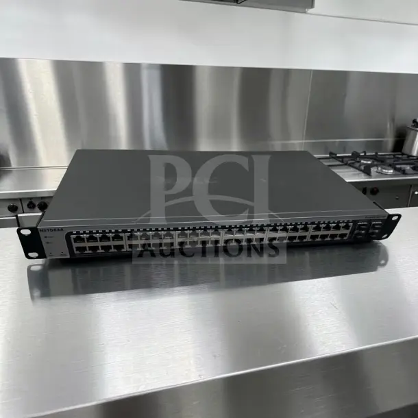 NETGEAR ProSAFE GS748Tv5, 48-Port Gigabit Ethernet Smart Switch, high-grade condition, fully tested, SFP ports visible.