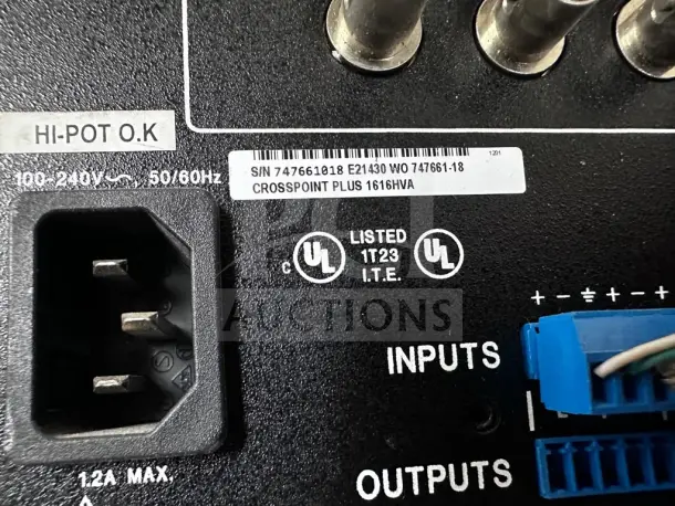 Close-up of NETGEAR ProSAFE GS748Tv5 showing power socket, labels, and UL certification markings.
