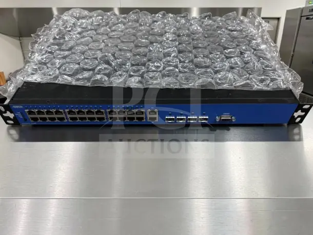 ADTRAN NetVanta 1234P 3rd Gen switch with 24 Fast Ethernet PoE ports, quad gigabit uplinks, tested, model 1703595G1.