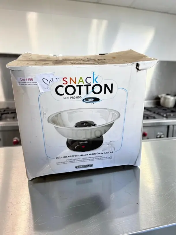 Excellent condition 100% Chef Snack Cotton Mini-Pro 600 cotton candy machine, 115V, 600W. Model CHE-S-COT-1339, fully tested. Box shows slight wear.