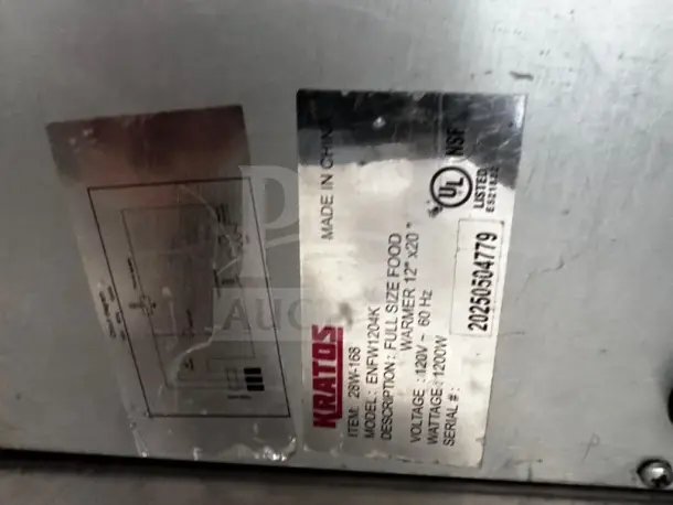 Label on Kratos 28W-600 food warmer showing model EWN-100K, 120V, 1200W, UL listed, made in China, full-size 12" x 20".