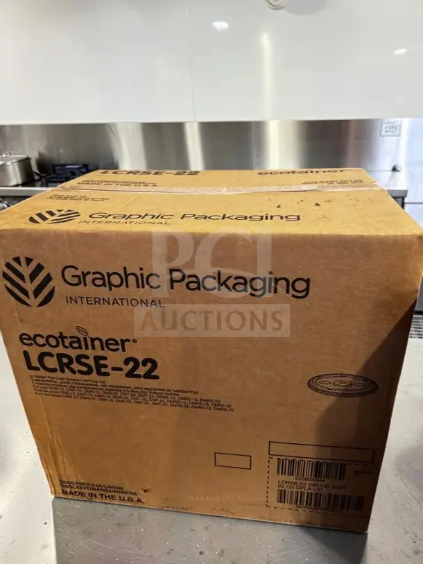 Brand-new sealed case of Graphic Packaging ecotainer LCRSE-22 lids, clear compostable PLA, 12–24 oz compatibility, 2,000 count.
