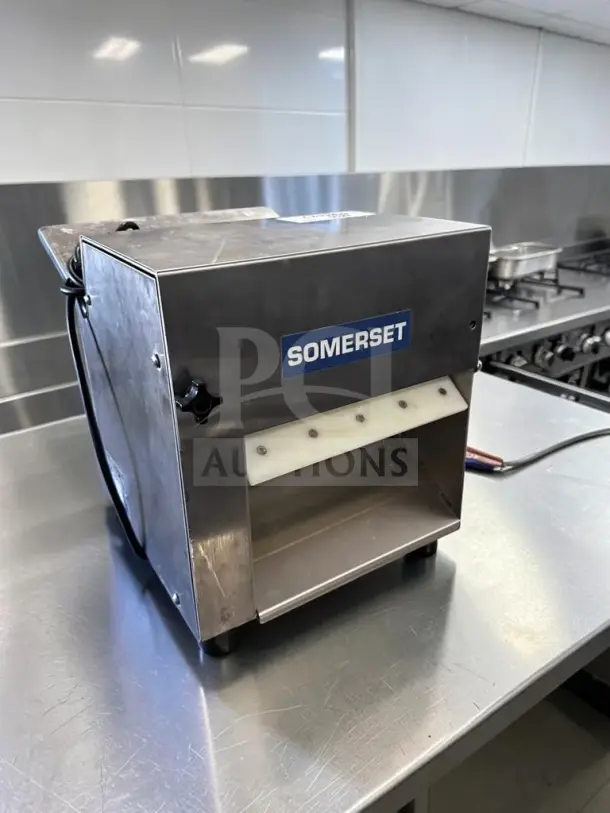 Somerset CDR-100P 10" countertop dough sheeter in outstanding condition, fully tested, model tag visible, 115V.