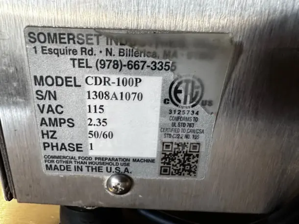 Label on Somerset CDR-100P dough sheeter indicating model, serial number, voltage, and compliance information.