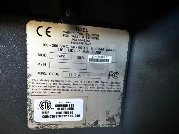 Tidel TACC IIA cash controller data plate showing model, serial number IA-34937, and voltage details, in prime condition.