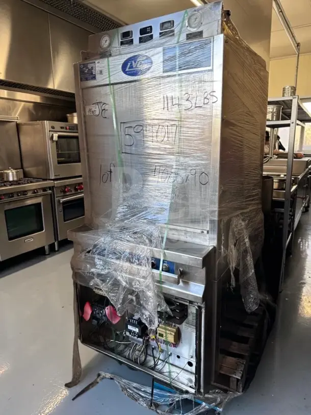 LVO FL14F 14-Pan Front-Load Commercial Washer in outstanding condition, wrapped for transport. Model: FL14 Series, 460V 3-Phase.