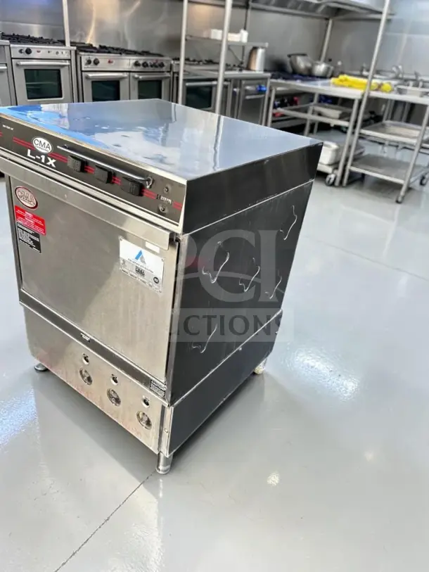 CMA Dishmachines L-1X undercounter dishwasher, well-maintained, 24" low-temp, handles 30 racks/hour, 115V, fully tested.