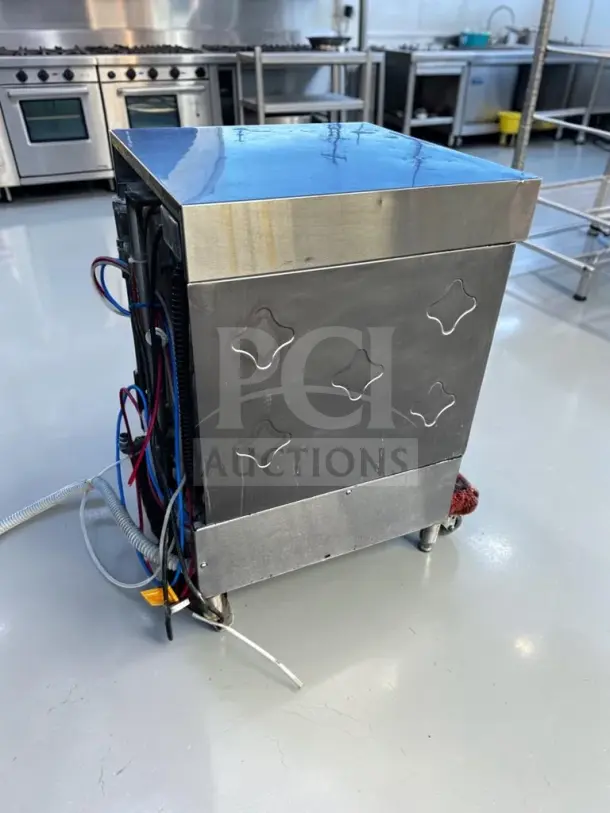 CMA Dishmachines L-1X undercounter dishwasher, 24" low-temp, well-maintained, 115V, 30 racks/hour, stainless steel finish.