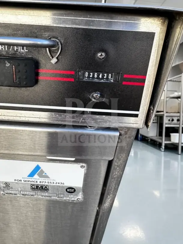 CMA Dishmachines L-1X undercounter dishwasher, well-maintained, low-temp, 30 racks/hour, label shows model and service info.